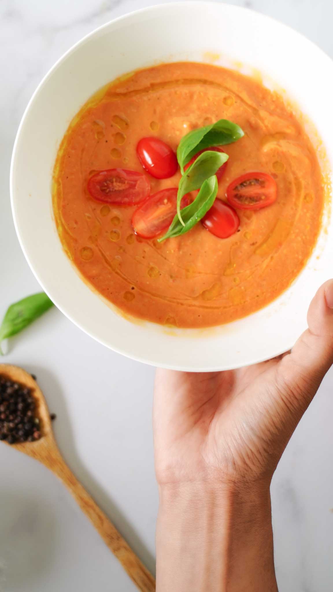 Served gazpacho in hand